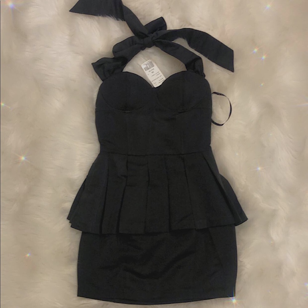 Charcoal gray mini skirt length halter dress.